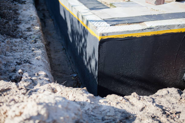 Professional Basement Waterproofing technician working in Vallonia, IN